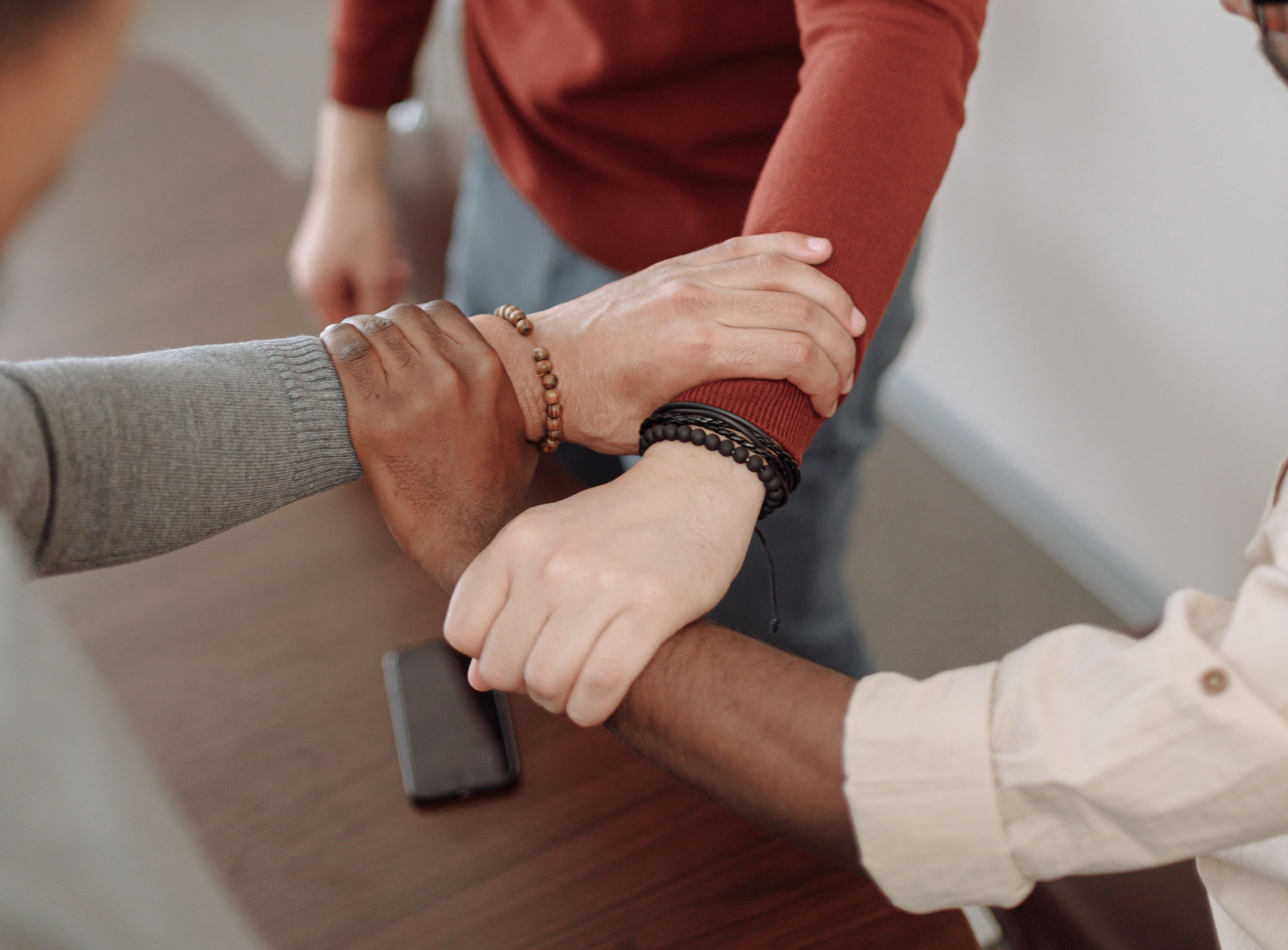 Hands clasped in a mentoring moment